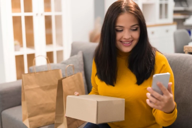 woman-checking-her-phone-new-purchase-cyber-monday