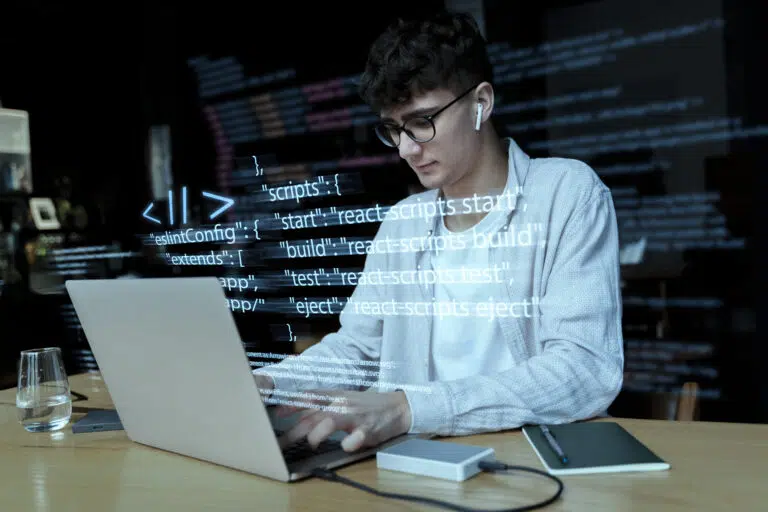 programming-background-with-person-working-with-codes-computer (1)